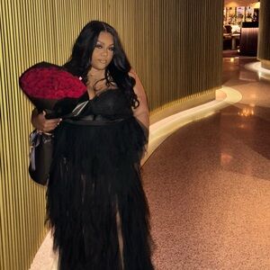 Elegant Black Gown with Red Rose Bouquet